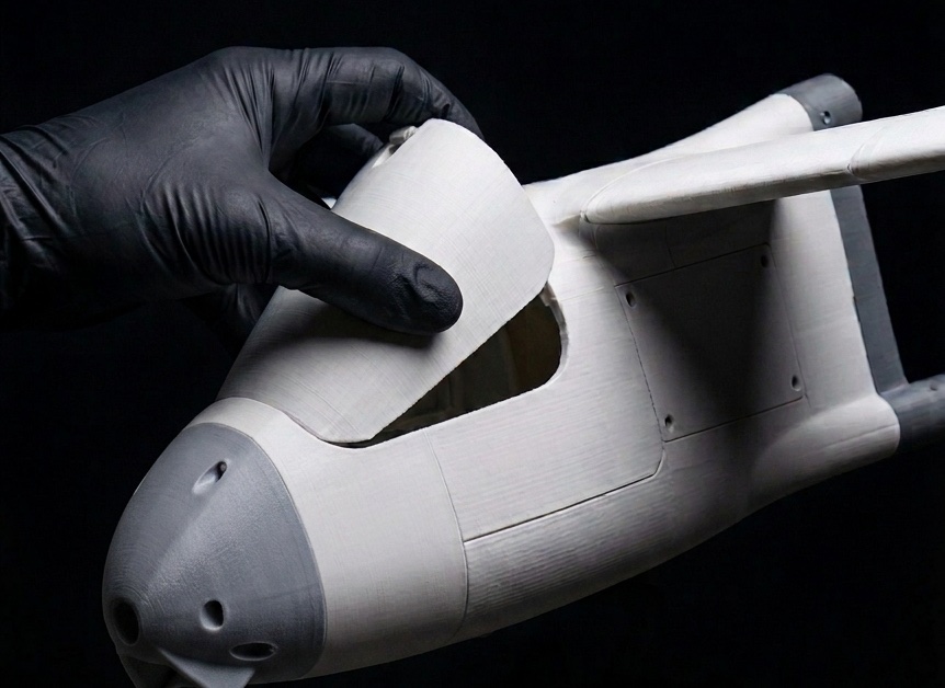 Hand holding the P1400 3D-printed airframe